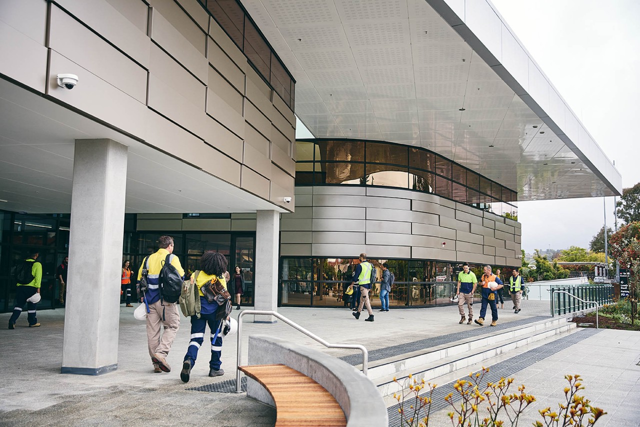 Construction students walking outside the building